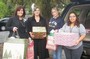 Karen Hedington delivers Christmas gifts at the Domestic Violence Center